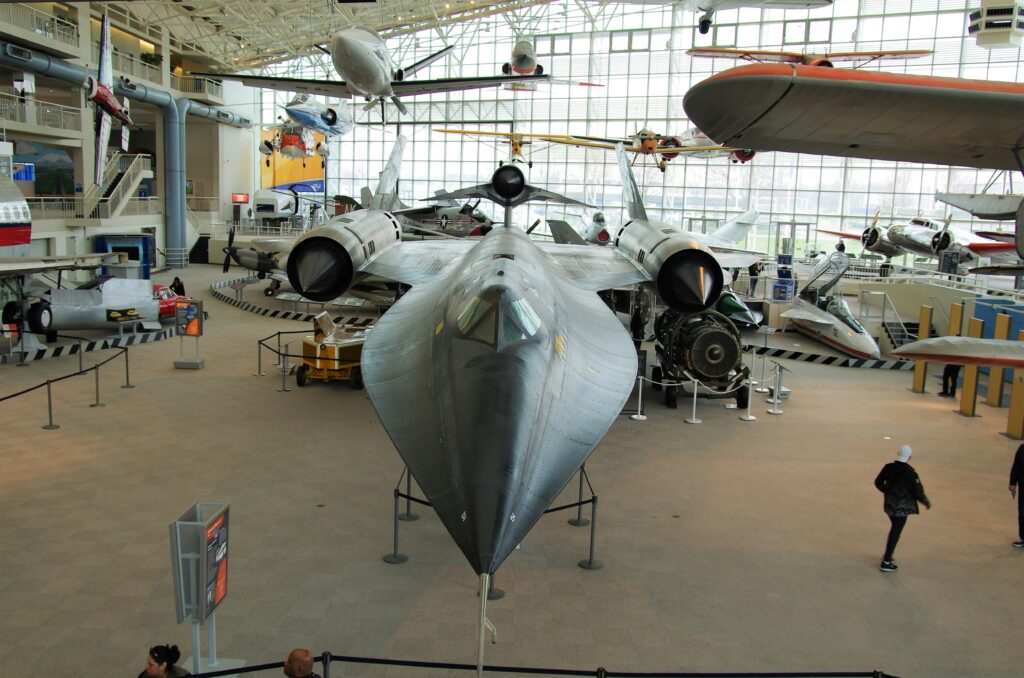 Military aircraft displayed indoors