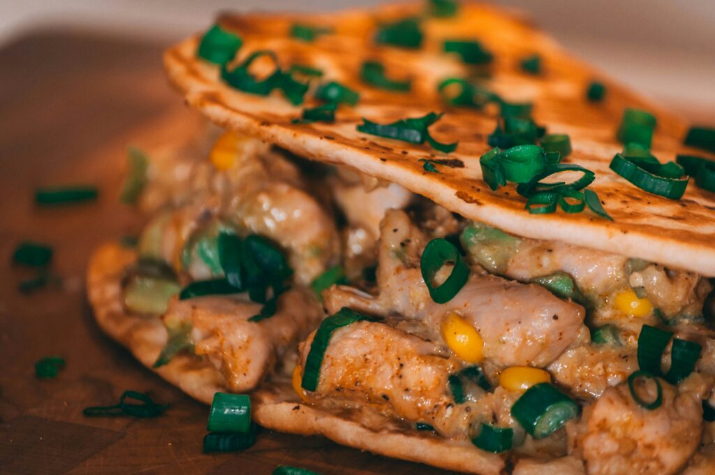 Chicken tacos garnished with herbs