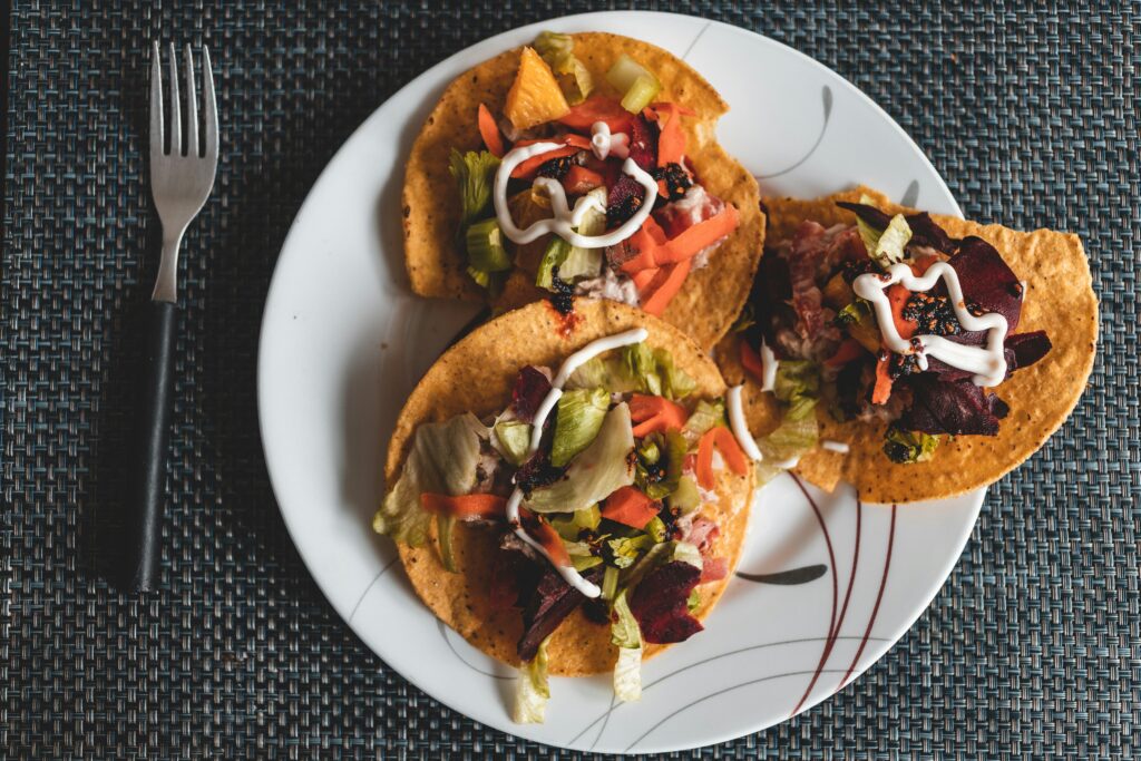 Plate of tacos with toppings