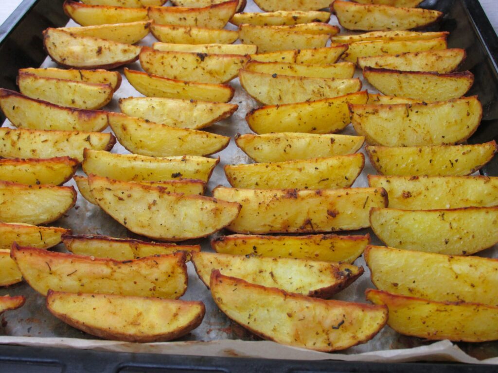 Roasted potato wedges on a tray