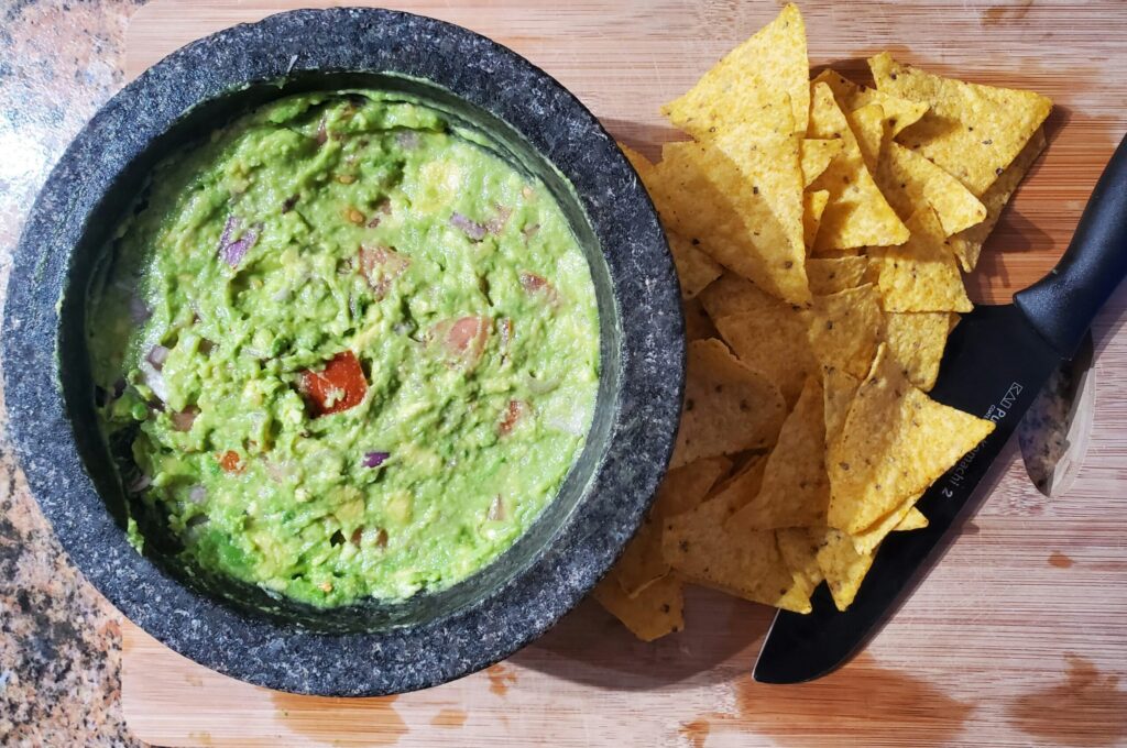 Bowl of guacamole with tortilla chips