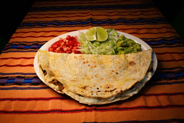 Burrito served with salsa and guacamole