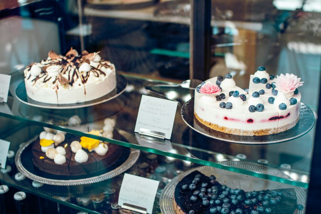 Cakes displayed in a bakery case
