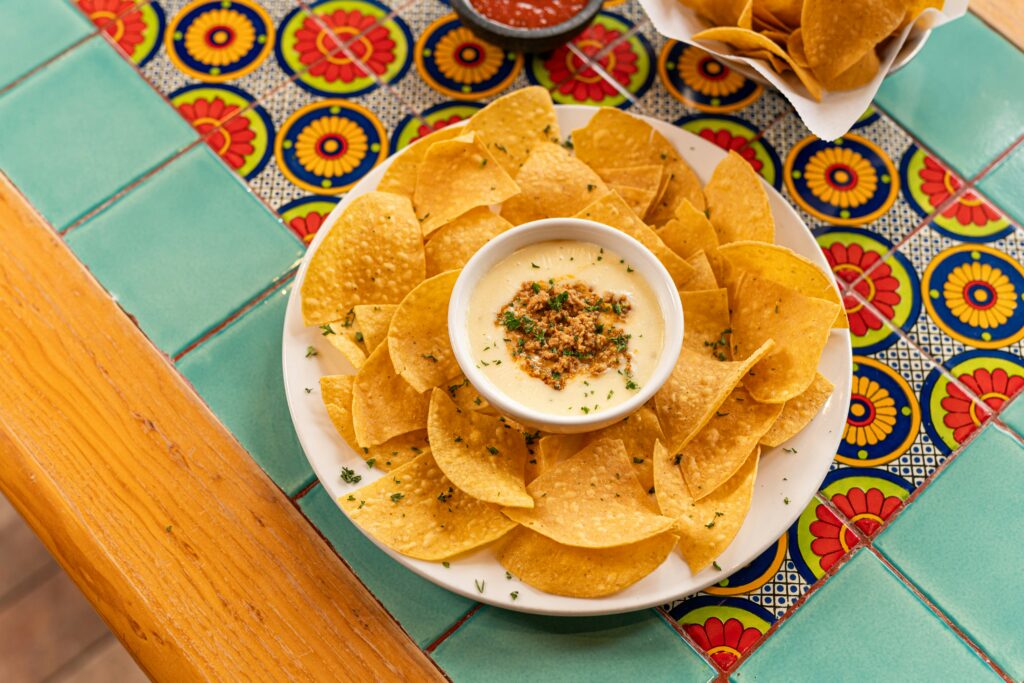 Plate of nachos with dipping sauce