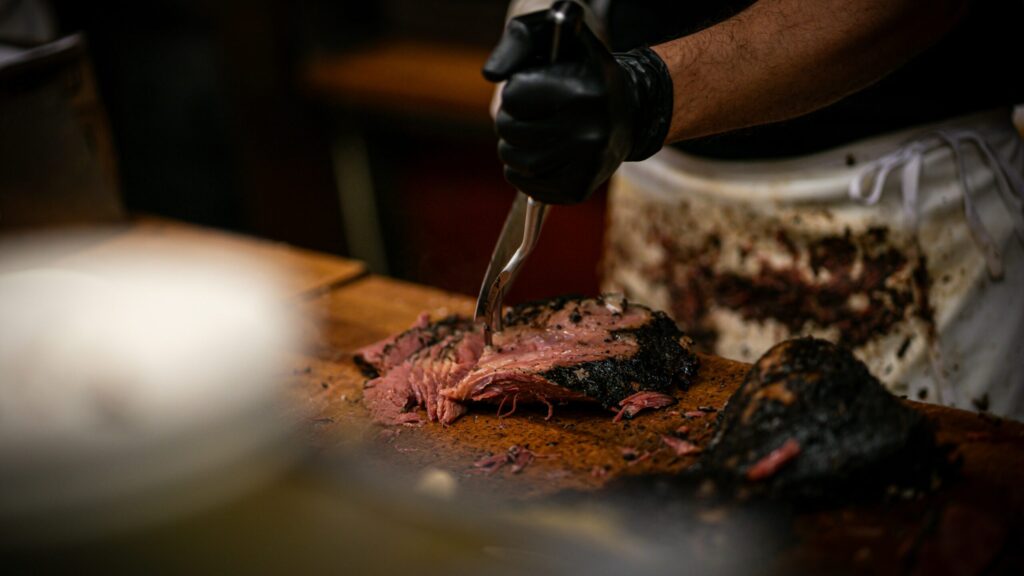 Sliced brisket being carved
