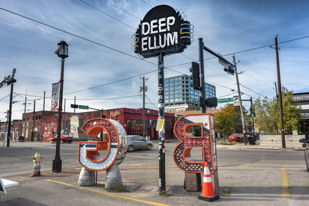Deep Ellum neighborhood sign at a street intersection in Dallas