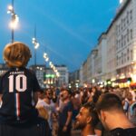 Large group of people in a city street at night during a public gathering