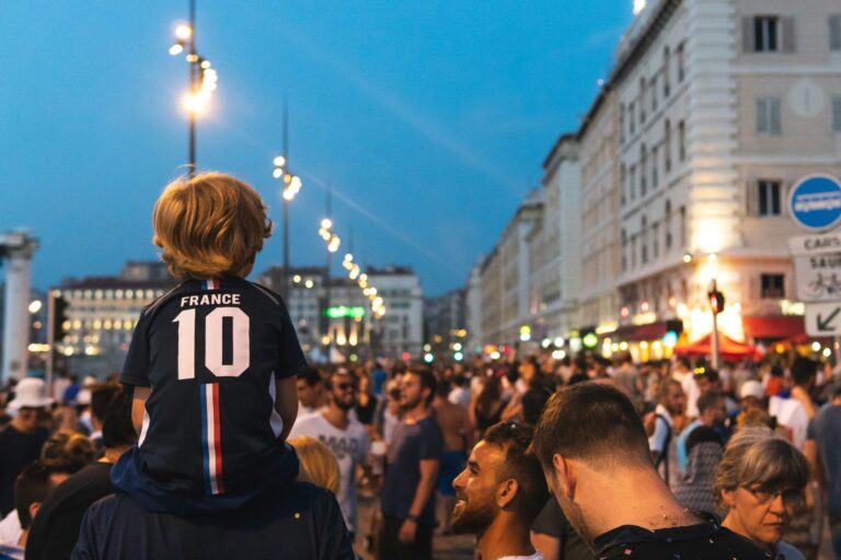 Large group of people in a city street at night during a public gathering